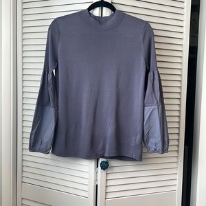 Long-sleeved purple top with unique sleeve details